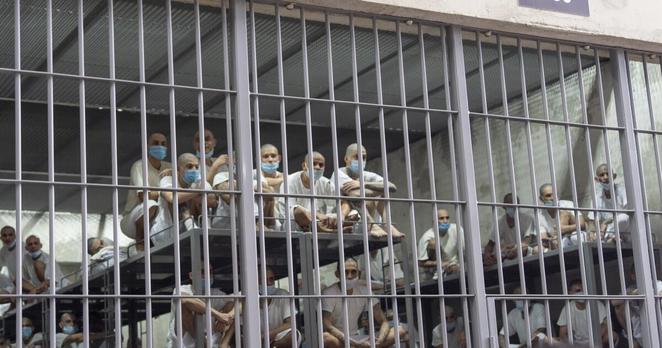 FILE - Prisoners look out of their cell as Homeland Security Secretary Kristi Noem tours the Terrorist Confinement Center in Tecoluca, El Salvador, March 26, 2025. (AP Photo/Alex Brandon, File) FILE - Prisoners look out of their cell as Homeland Security Secretary Kristi Noem tours the Terrorist Confinement Center in Tecoluca, El Salvador, March 26, 2025. (AP Photo/Alex Brandon, File)