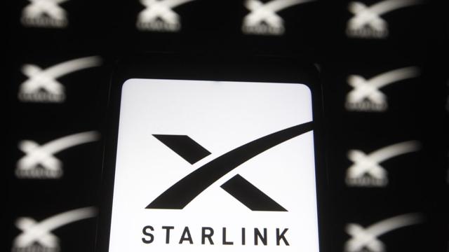 Photo illustration with Starlink logos displayed on a smartphone and PC screen.