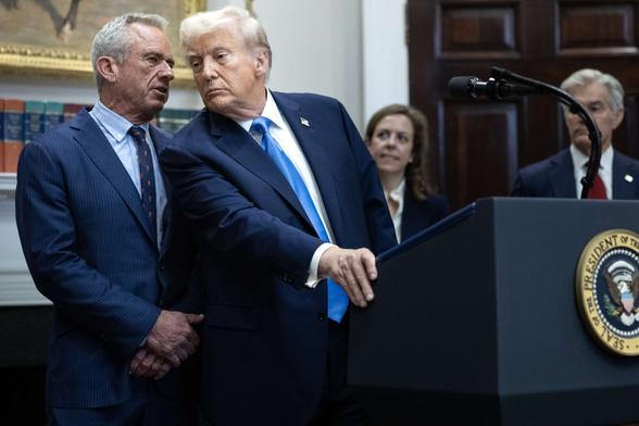 Health and Human Services Secretary Robert F. Kennedy Jr. speaks quietly to President Donald Trump during a news conference on September 22, 2025, inside the Roosevelt Room at The White House in Washington, D.C.